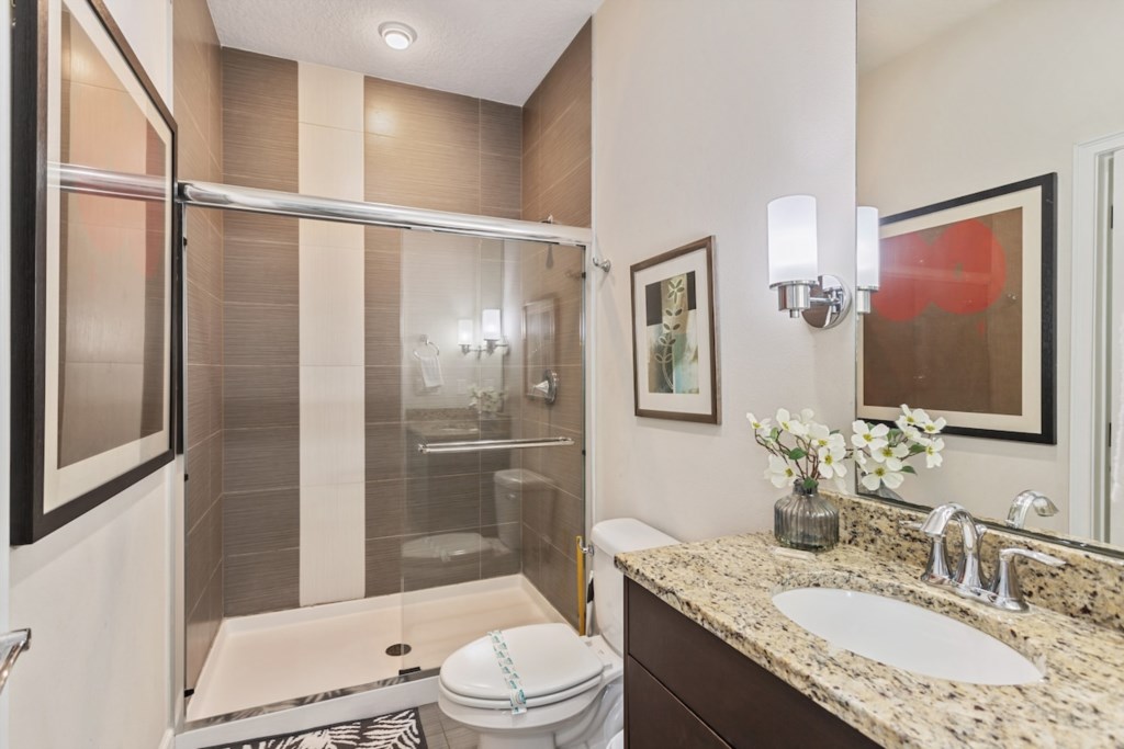 Spacious bathroom with walk-in shower and elegant design.