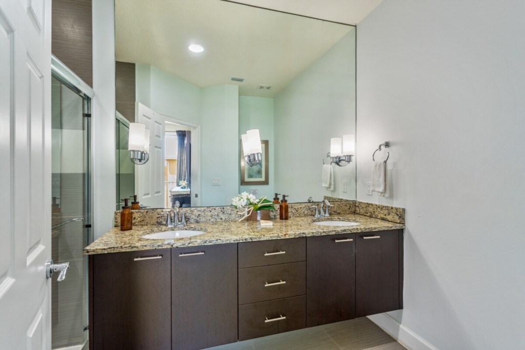 Modern bathroom with dual sinks and plenty of counter space.