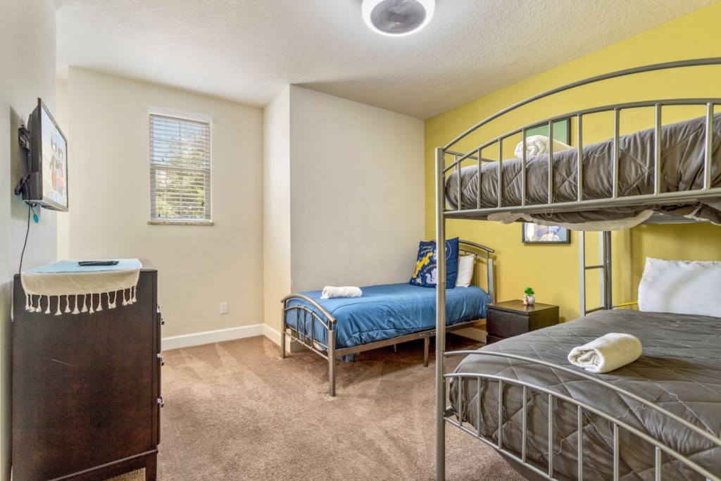 Kids' Bedroom: Features one twin bed and one bunk bed, designed for fun and comfort.