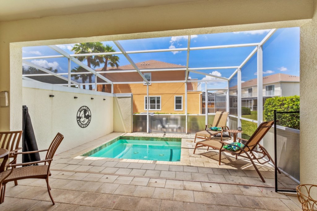 Private screened-in pool with lounge chairs for ultimate relaxation.