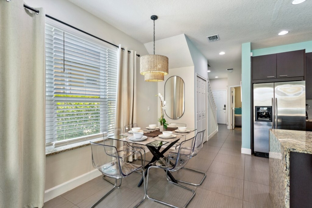 Open dining space with large windows, bringing in plenty of daylight.