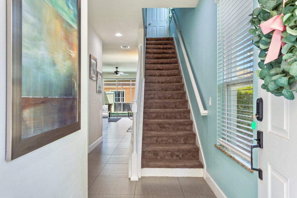 Staircase to the Second Floor: Provides access to the upper level of the home.