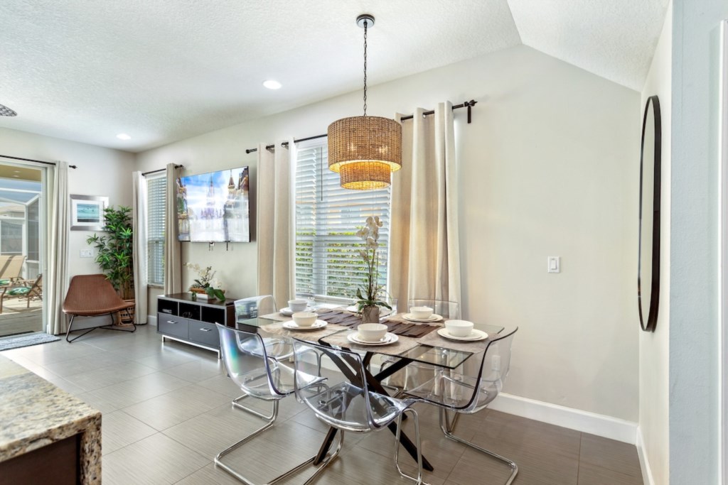 Bright dining area with seating for six, perfect for family meals.