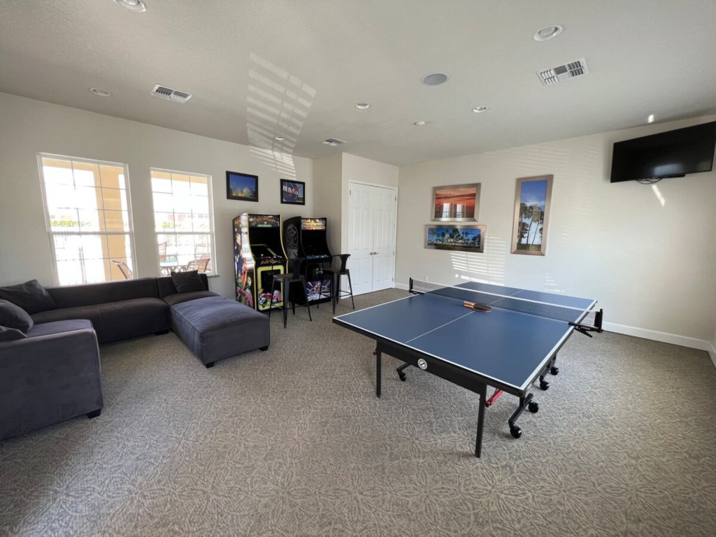 Communal Clubhouse: Includes arcade games and a table tennis setup for entertainment and fun.