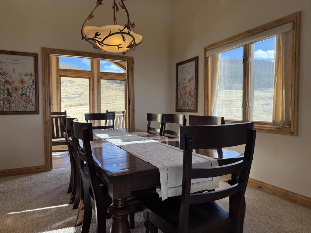 Dining table that seats 8 with amazing views of the property and national forest