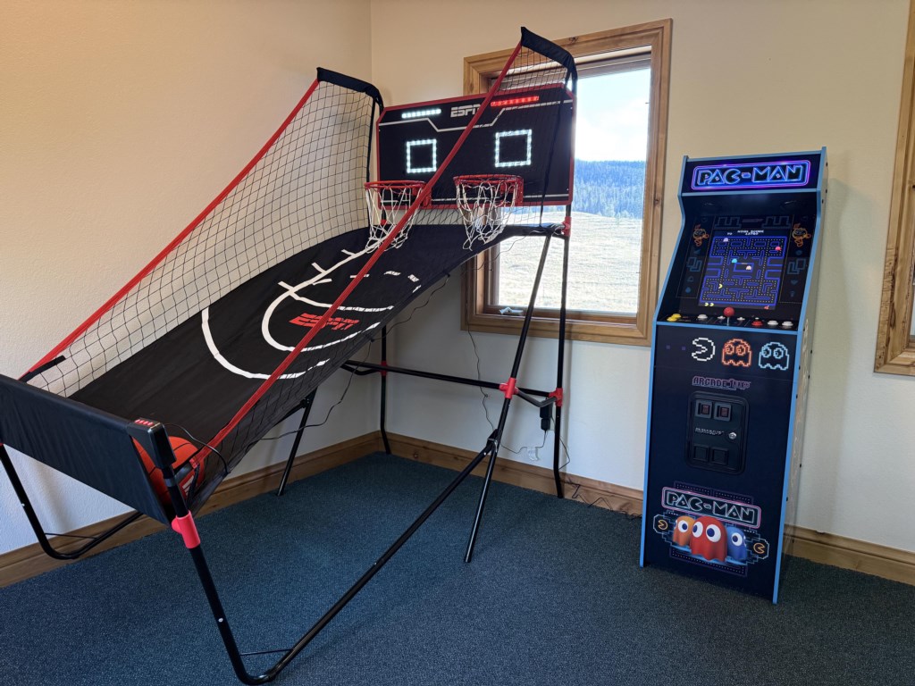 Game room with basketball, arcade games, and PS4
