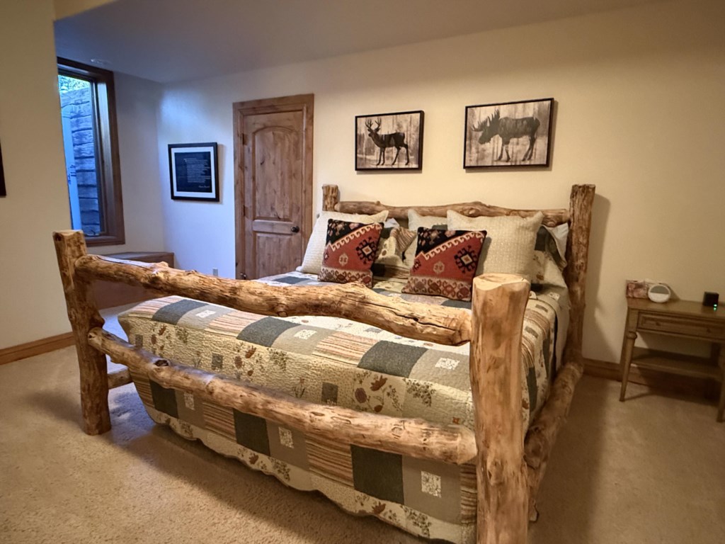 Basement bedroom with King bed, tv, and Jack and Jill bathroom