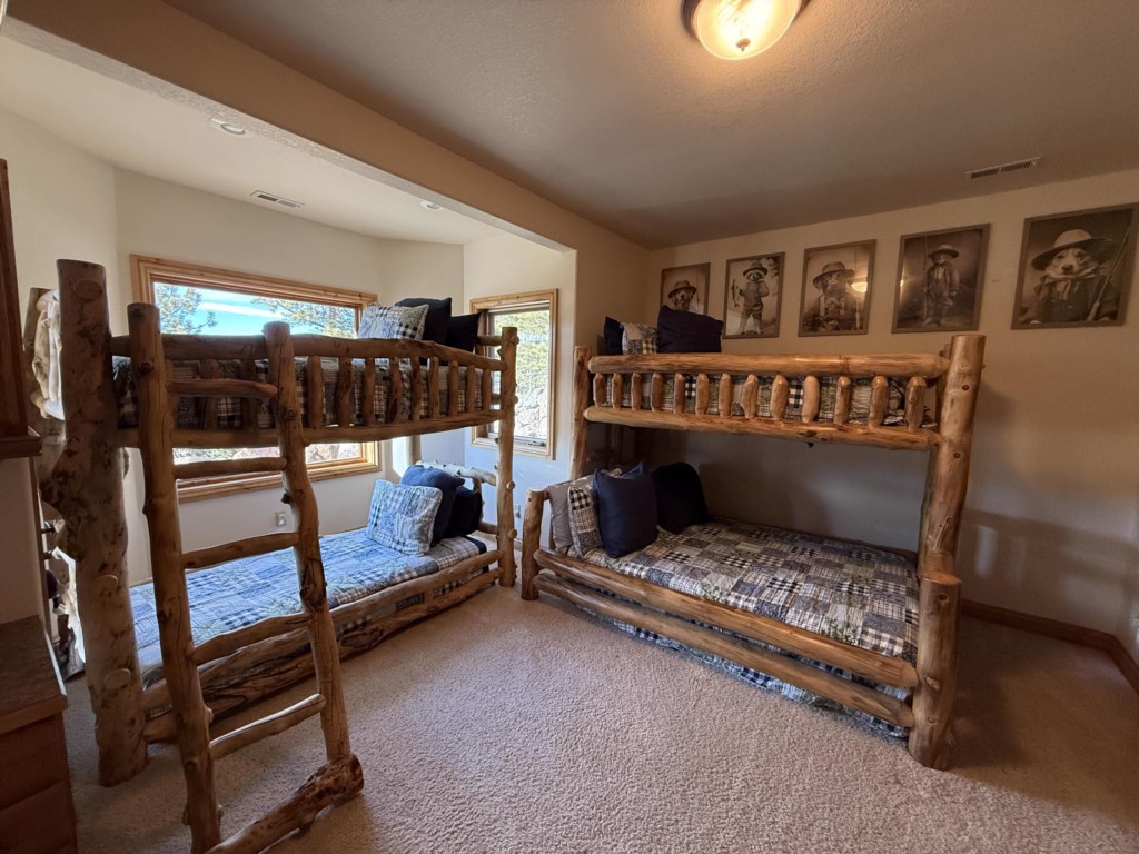 Bunk room with a twin xl, full xl, and 2 twin beds