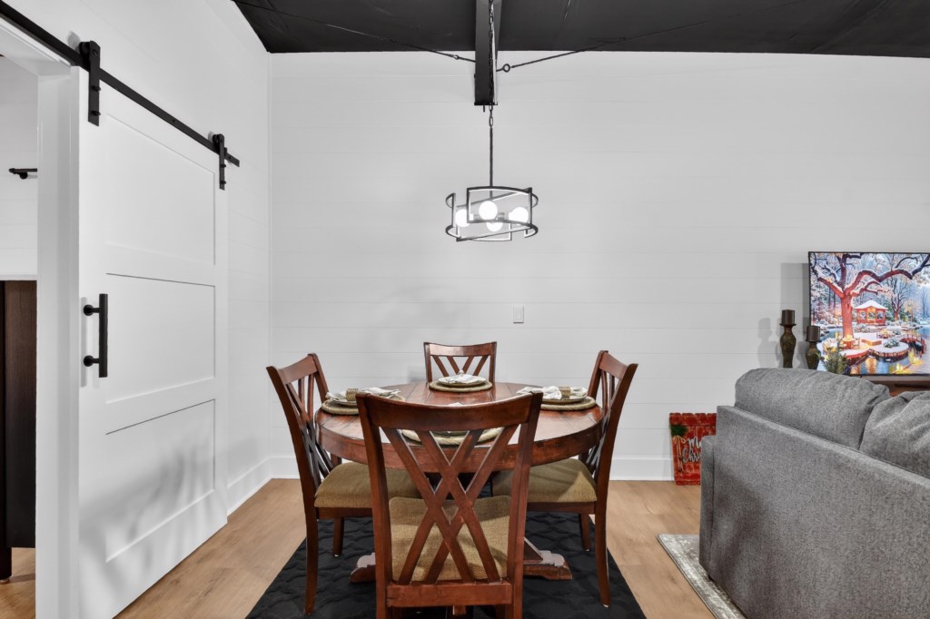 Enjoy your meal or play a game at the 4 person dining table