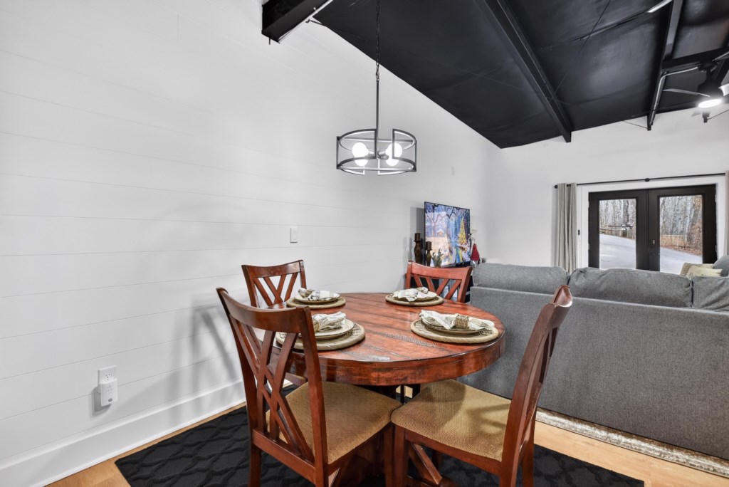 Enjoy your meal or play a game at the 4 person dining table