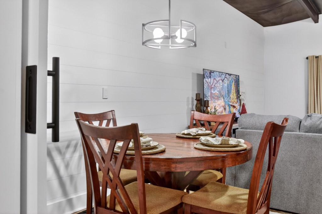 Enjoy your meal or play a game at the 4 person dining table