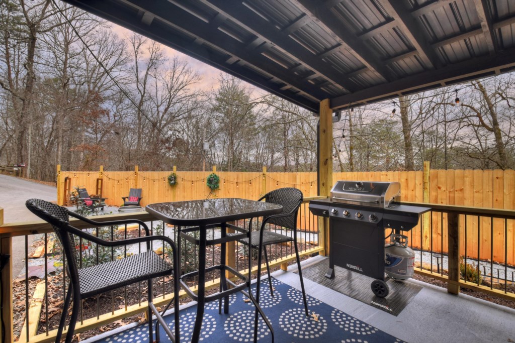 Cook dinner on the gas grill and enjoy your meal at the outdoor dining area