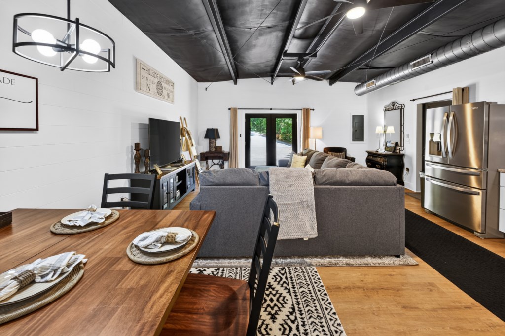 Open-concept living area with cozy seating and dining space, perfect for relaxation and entertainment.