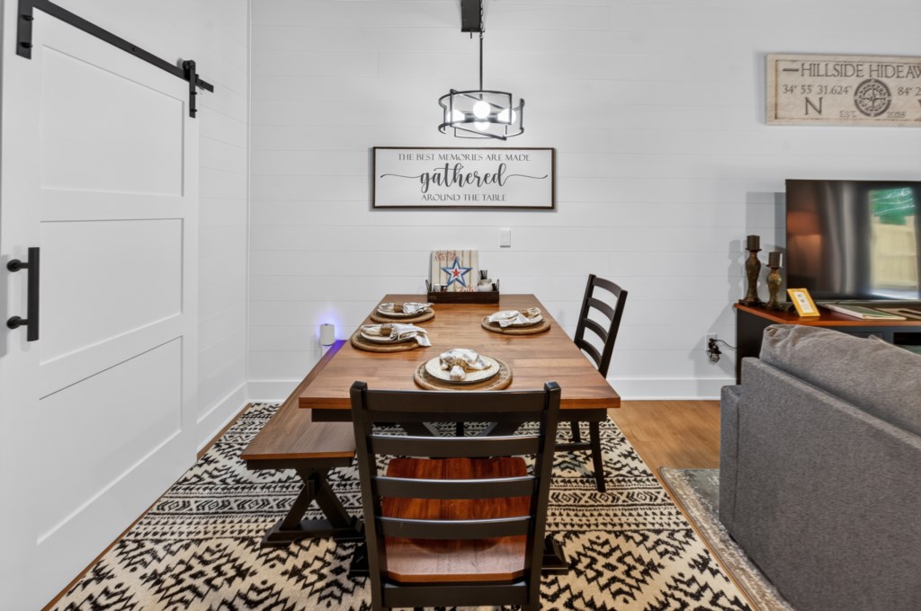 Charming dining area with rustic table, perfect for family meals and cozy gatherings.