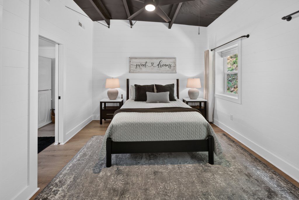 Cozy bedroom with rustic charm and soft lighting, perfect for a restful night's sleep.