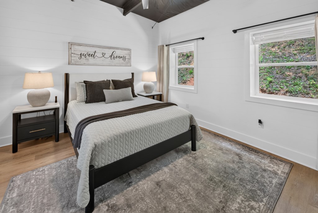 Cozy bedroom with natural light and plush bedding for a restful night's sleep.