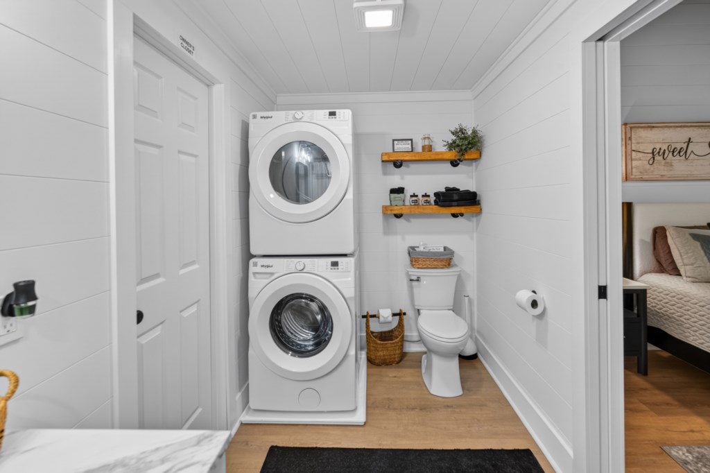 Convenient laundry area in bathroom with modern washer and dryer.