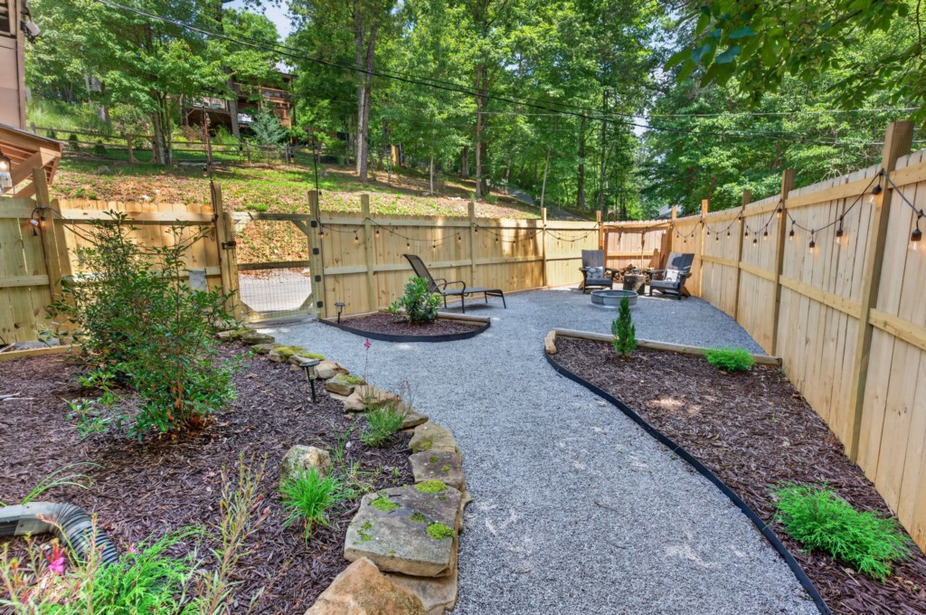Charming backyard with firepit and seating, perfect for evening relaxation.