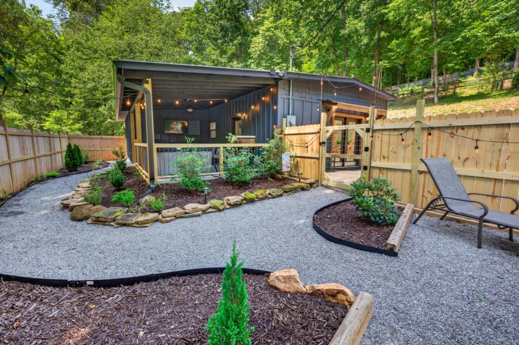 Charming outdoor area with cozy seating and string lights, perfect for relaxing evenings.