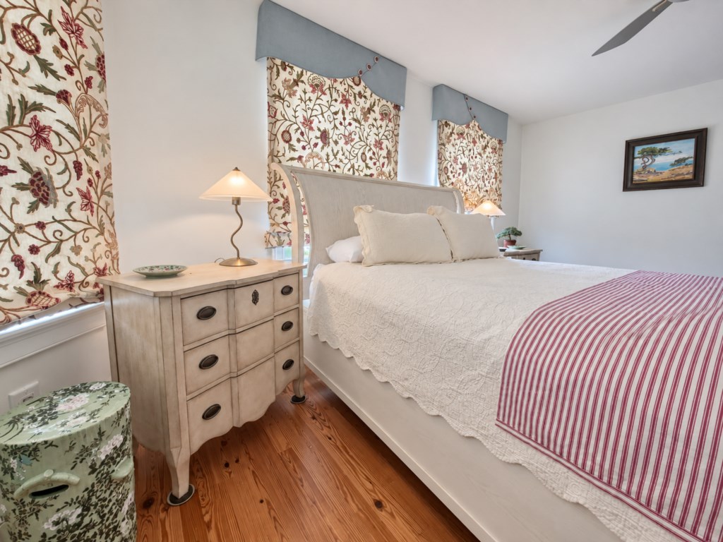 Bright, comfortable  queen bedroom with beautiful hardwood floors and plenty of natural light.