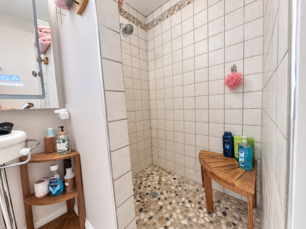 Walk in shower in the primary suite