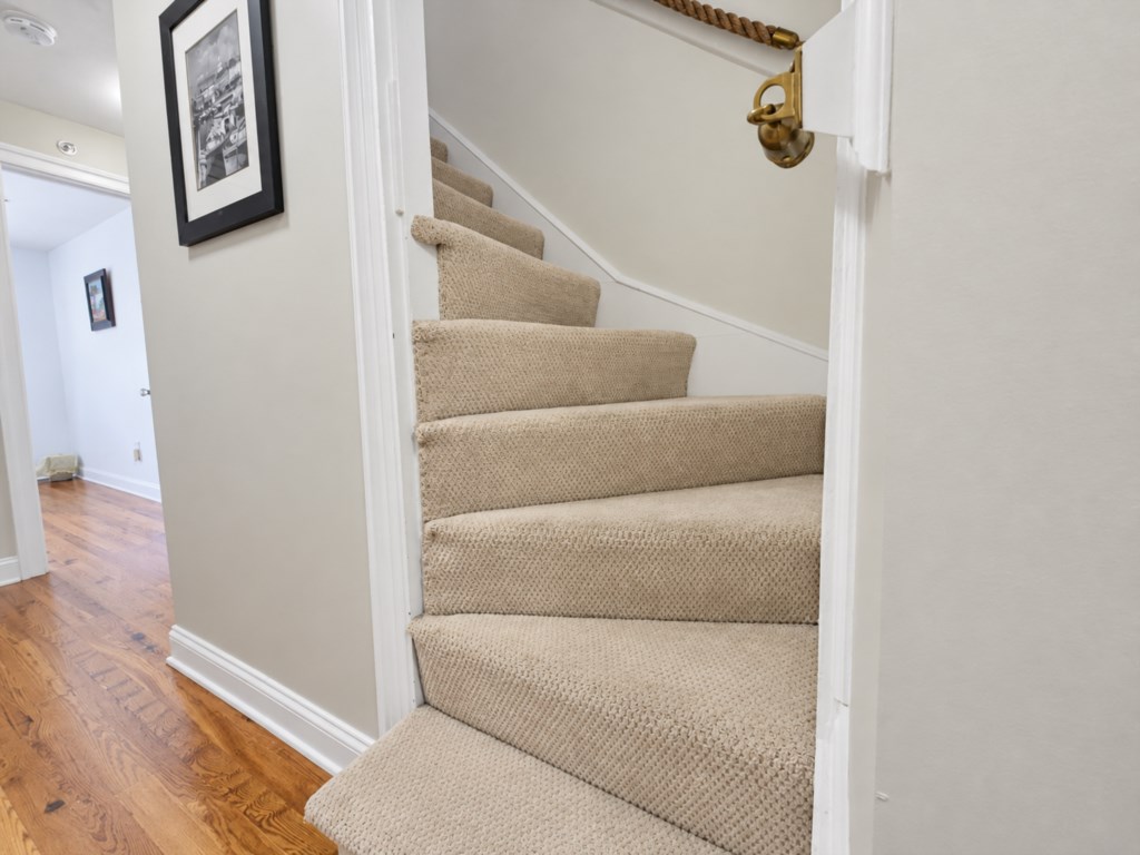 Stairs to 2nd fl. bedrooms and full bathrooms