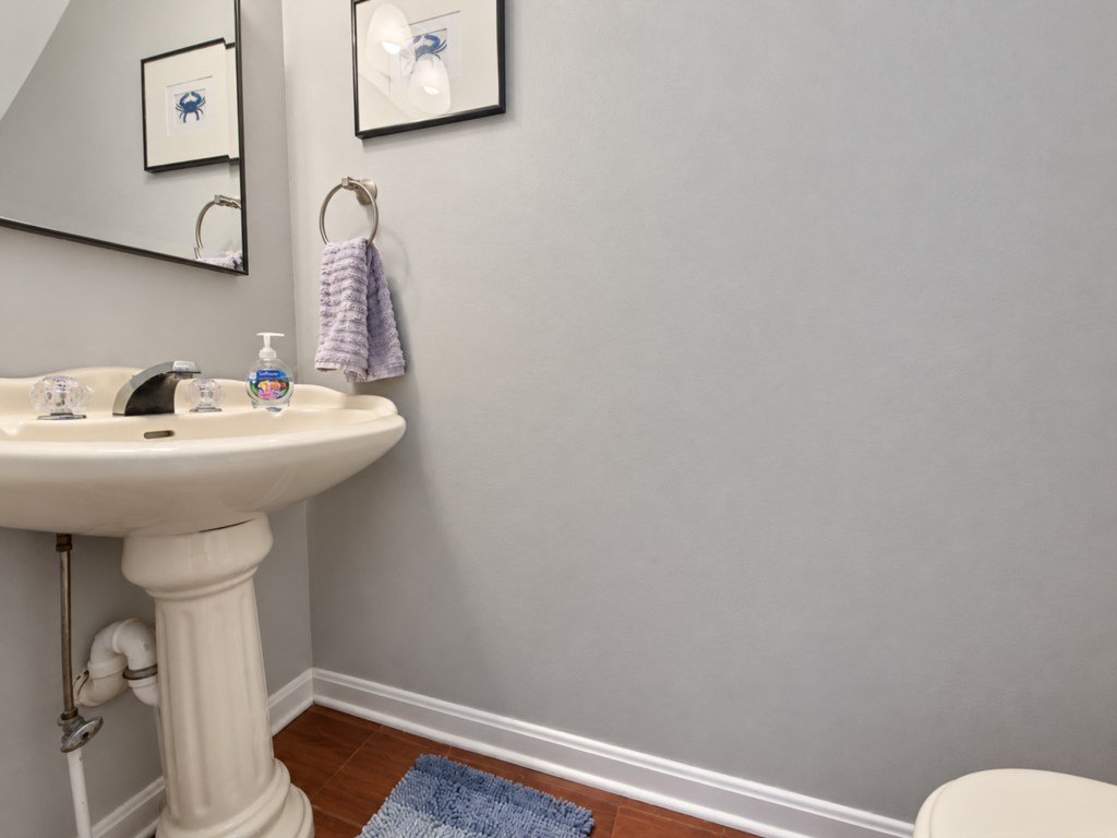 Powder room with a pedestal sink.