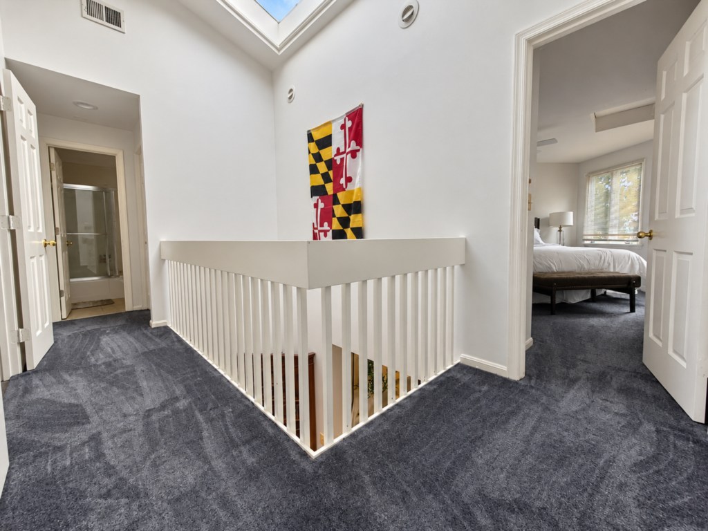 Skylit upstairs landing overlooking the main level