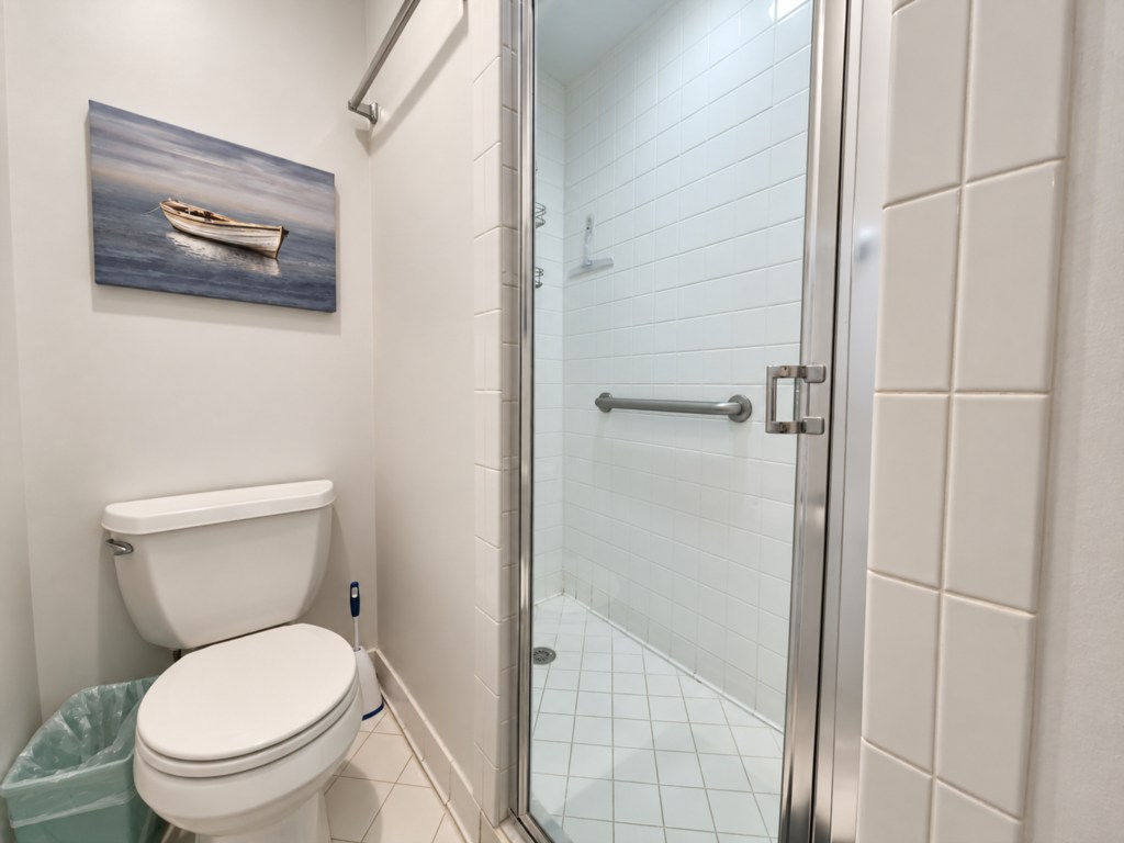 Primary Bathroom with a glass-enclosed walk-in shower.