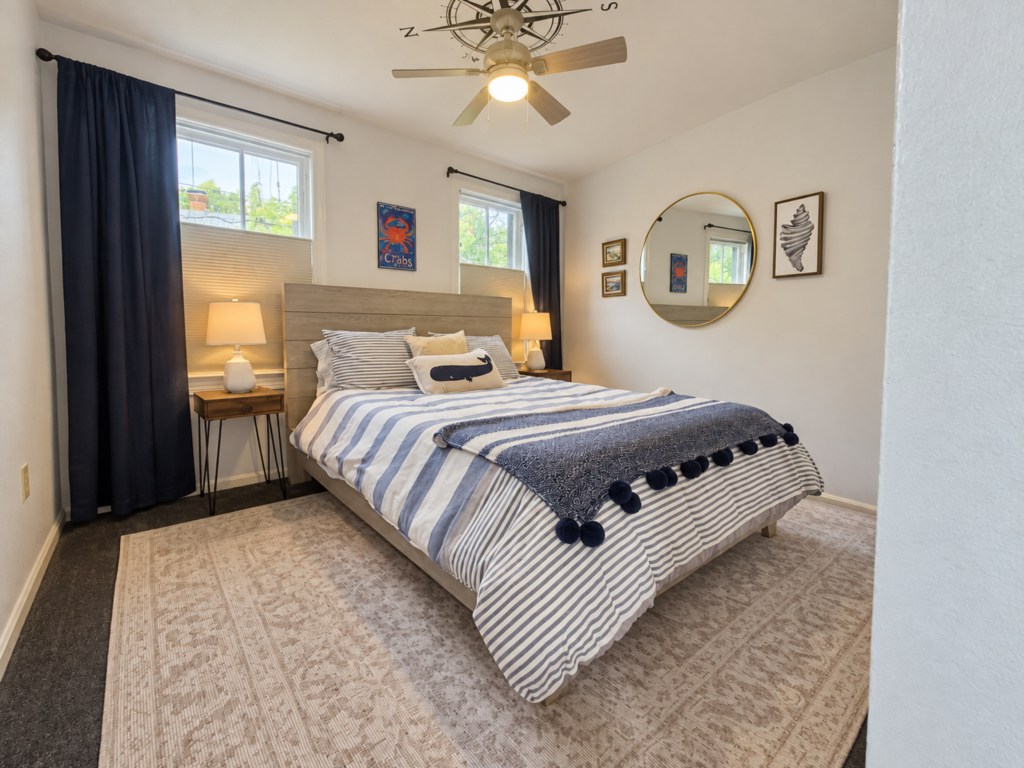 Welcoming bedroom with bedside lamps and coastal décor.