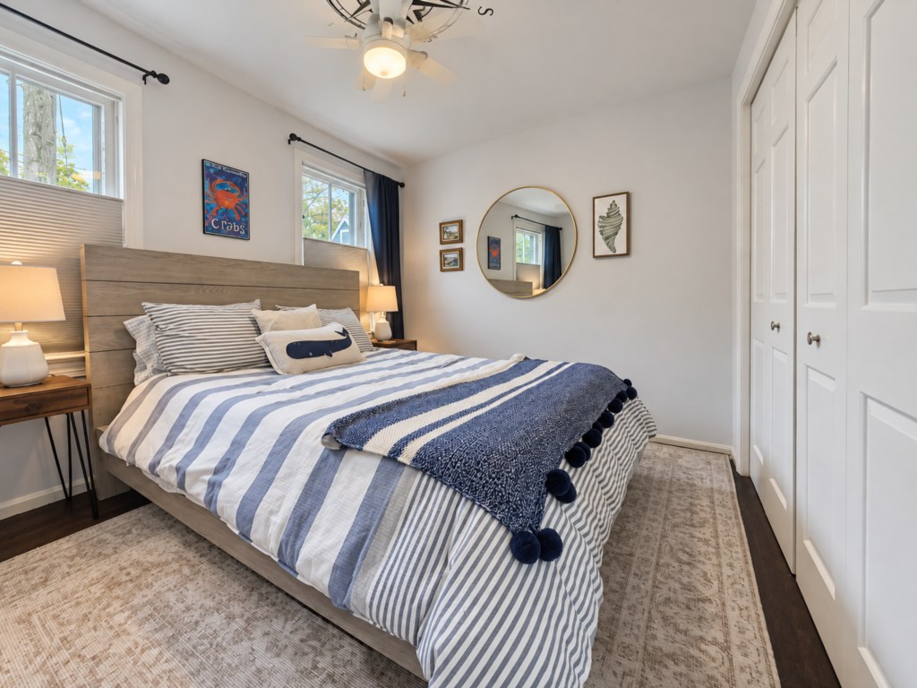 Coastal-inspired bedroom with blue-and-white bedding.