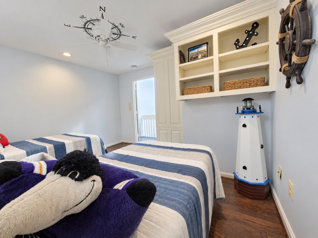 Nautical bedroom details, including a decorative lighthouse.