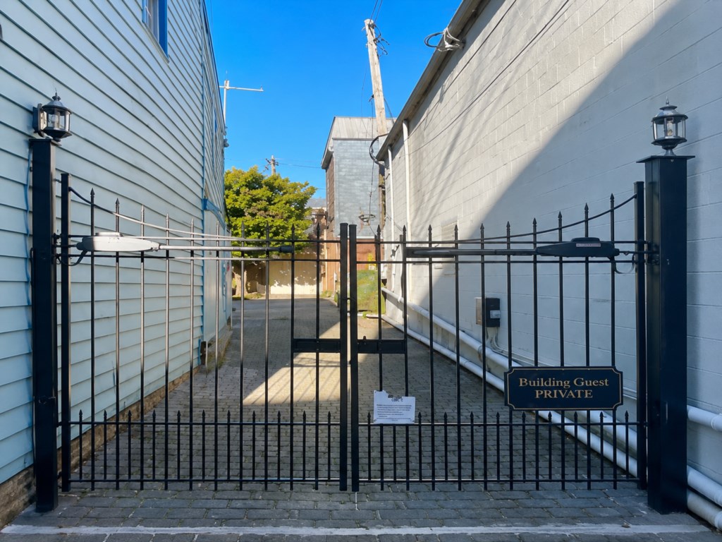 Electric gate leads to private access  to courtyard and unit/garage