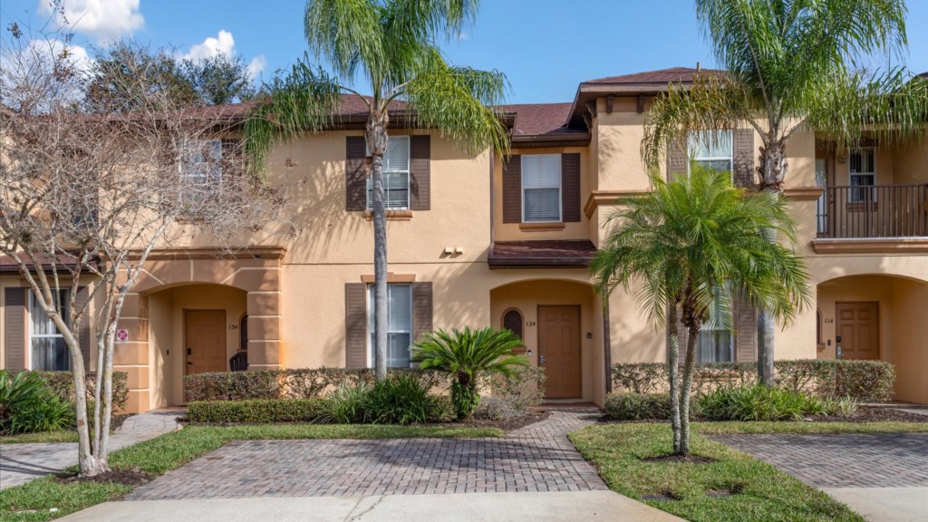 Exterior Front View
Beautiful townhome with tropical landscaping and private front entrance.