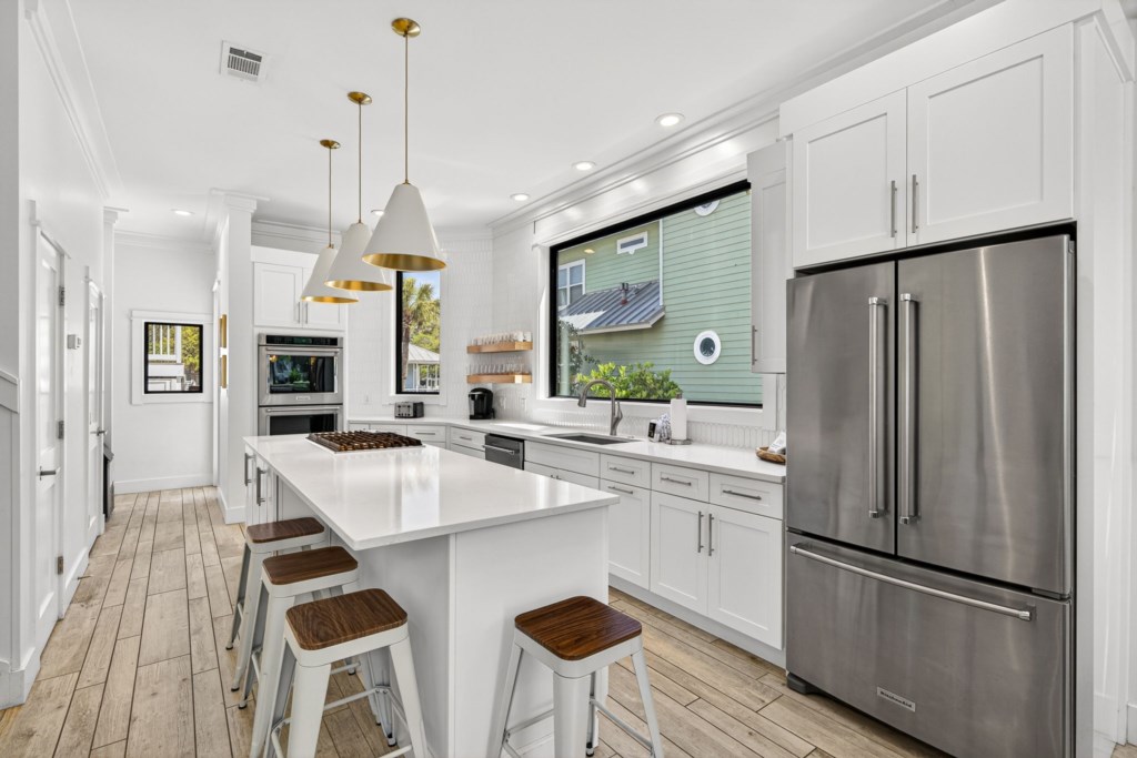 Kitchen With Island Bar and Modern Amenities
