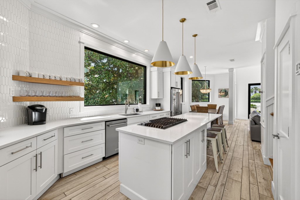 Kitchen With Island Bar and Modern Amenities