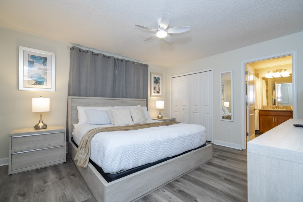 Master bedroom with king size bed and flat screen TV