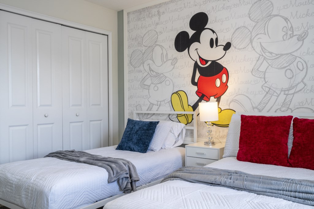 Mickey Themed bedroom with full + twin bed and flat screen TV