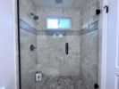 Upgraded Bathrooms with custom tiling and countertops view 2
