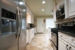 Partial Open-concept Custom Kitchen View 2
Has granite countertops and custom panel cabinetry with stainless steal