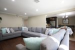 Living Room with Oversized sectional and Sleeper Sofa View 3
has Queen Pull-out looking into the Kitchen and Dining Room