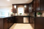 Custom Open Concept Kitchen with Stainless Steel Appliances View 2