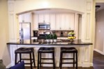 Open Concept Custom Kitchen with Stainless Steel Appliances view 2