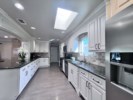 Spacious Custom Kitchen with Granite Countertops
and stainless steel appliances