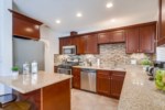 Custom Kitchen with Granite Countertops and Stainless Steel Appliances