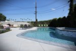 Beautiful In-ground Pool and Jacuzzi with Patio Seating