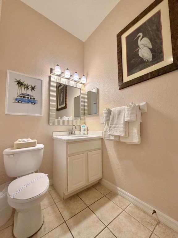 Bright guest bathroom with fresh towels provided.
