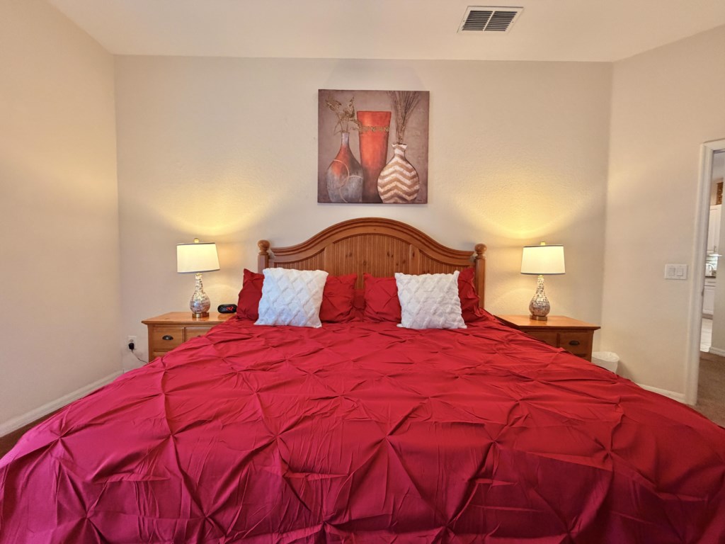 Wake up refreshed in the peaceful primary bedroom.
