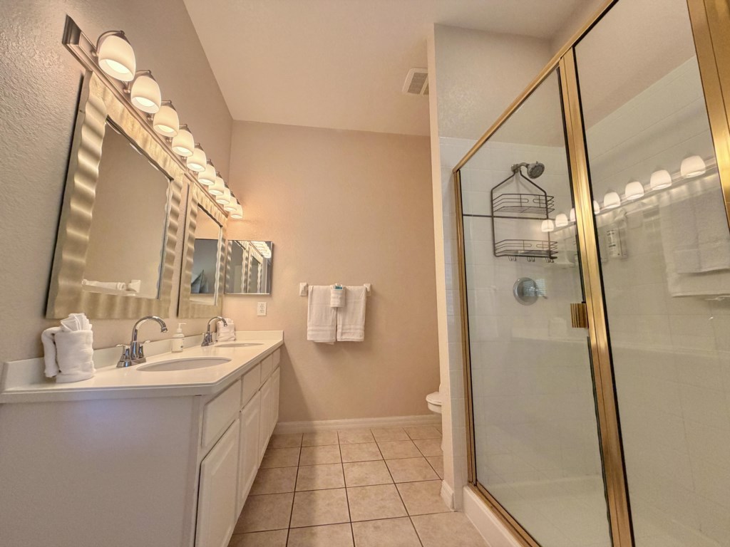 Spacious primary bathroom with a relaxing walk-in shower.
