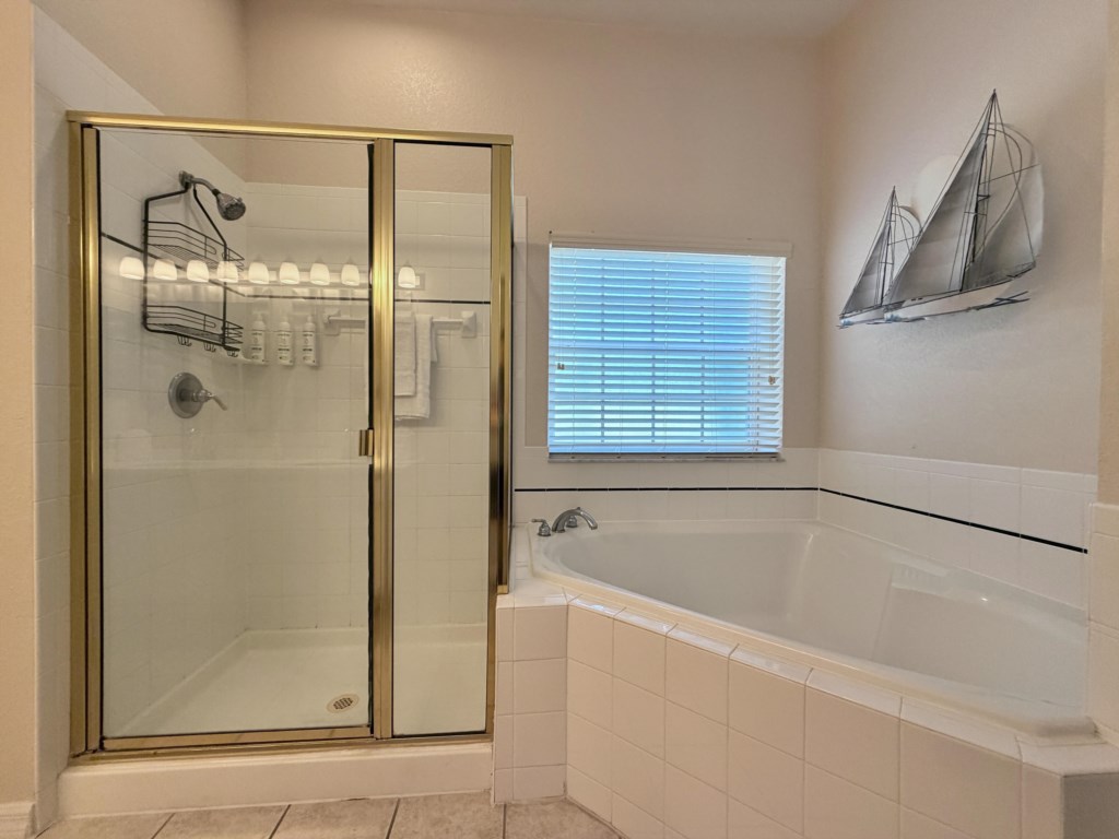 Spacious primary bathroom with a relaxing walk-in shower.

